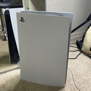 PS5 with cords and controller .